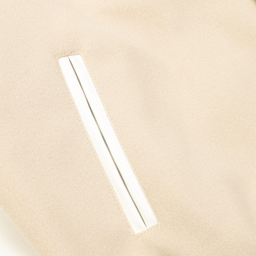 Beige bomber jacket sleeve with slim white stripe accent