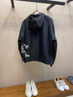 Hooded jacket with dark fabric, hood up, full zipper, side view with drawstring