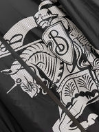 Close-up of black jacket with white graphic pattern and lines