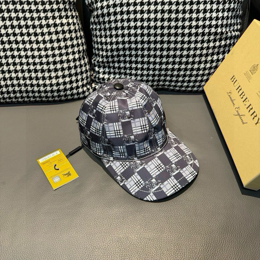 Burberry checkered cap viewed at an angle, black and white plaid design with metal top button.