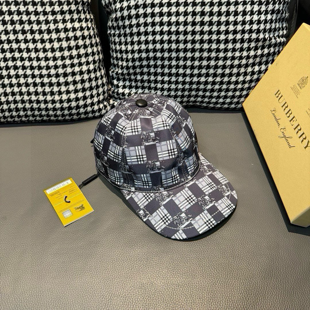Burberry checkered cap viewed at an angle, black and white plaid design with metal top button.