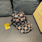 Burberry cap with black, white, orange, and red checkered pattern, side view