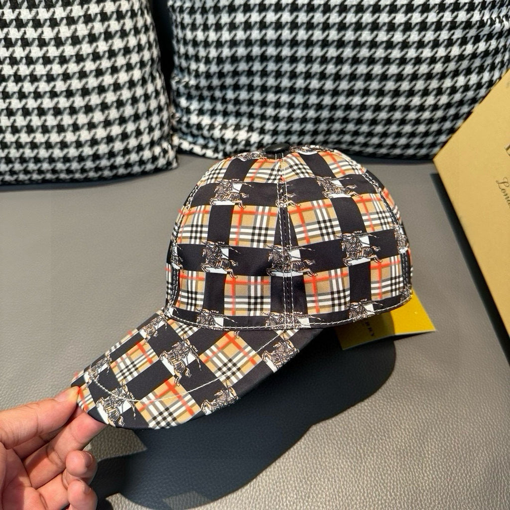 Burberry cap with plaid fabric and curved brim, held in hand for front-left view