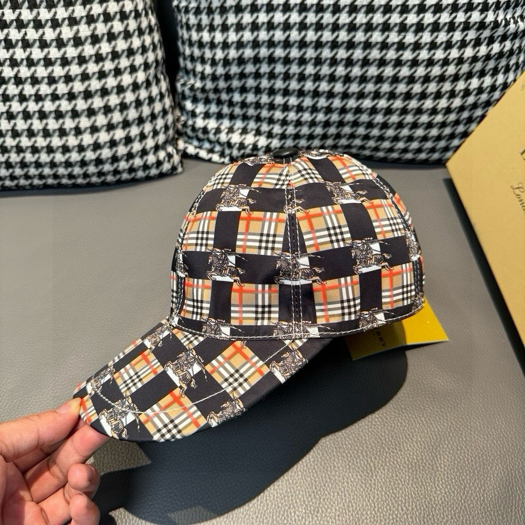 Burberry cap with plaid fabric and curved brim, held in hand for front-left view
