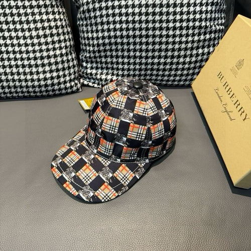 Burberry cap in black-and-orange plaid with curved brim and stitched crown