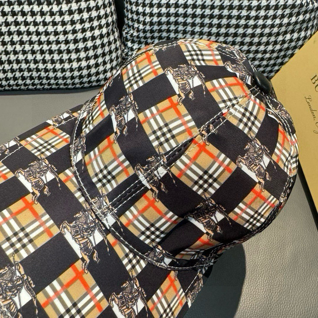 Burberry cap close-up showing black strap stitching and multicolor plaid panels