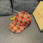 Orange plaid baseball cap with dark horse print, curved brim and side profile