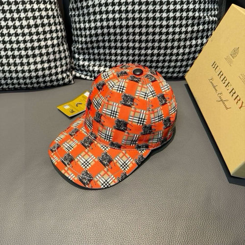 Orange plaid baseball cap with dark horse print, curved brim and side profile