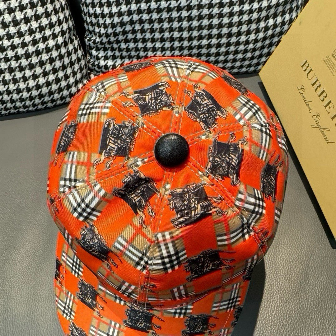 Orange plaid baseball cap top view with dark horse print and round button
