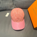 Two-tone baseball cap with Louis Vuitton monogram, peach crown and pink brim.