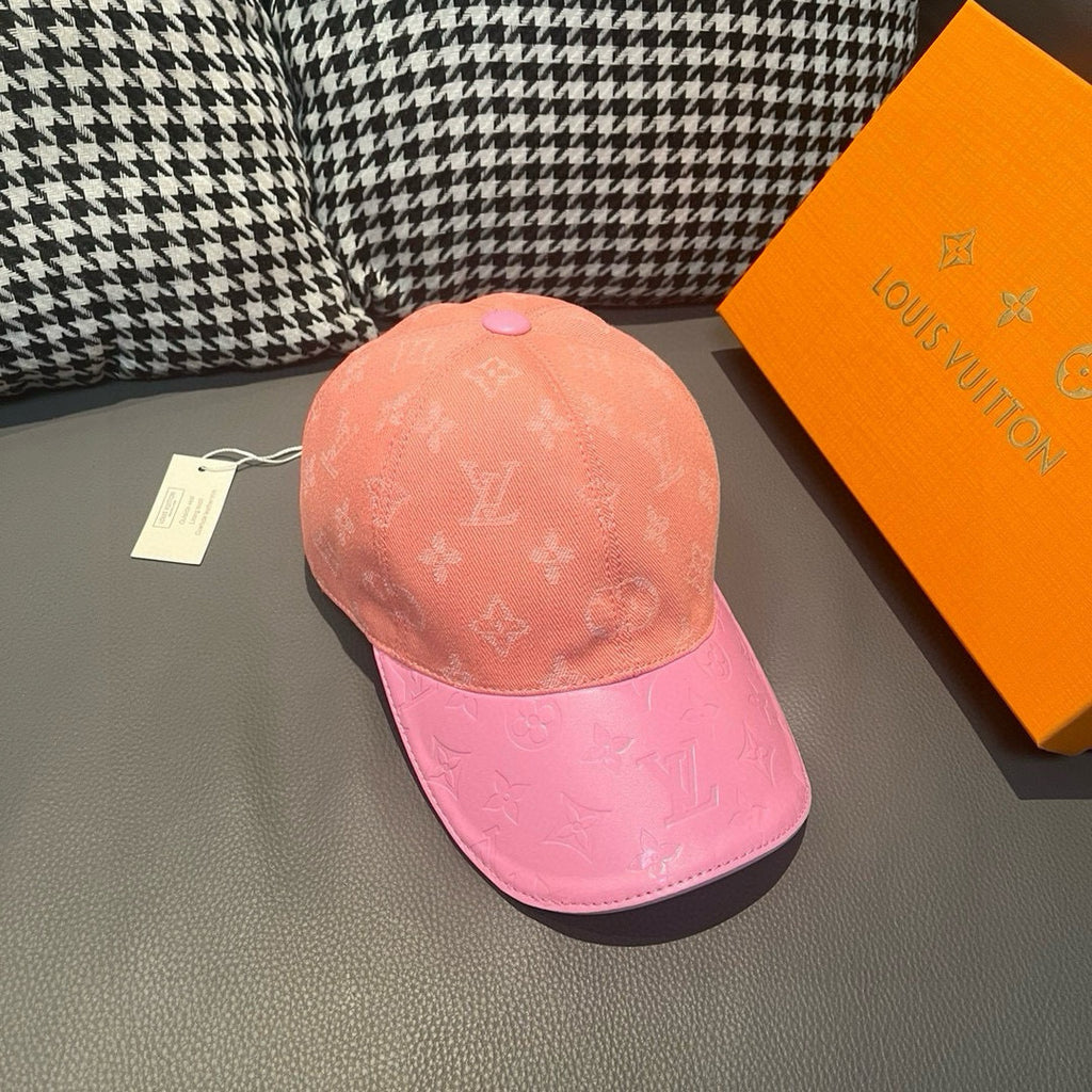 Two-tone baseball cap with Louis Vuitton monogram, angled view of peach crown and pink brim.