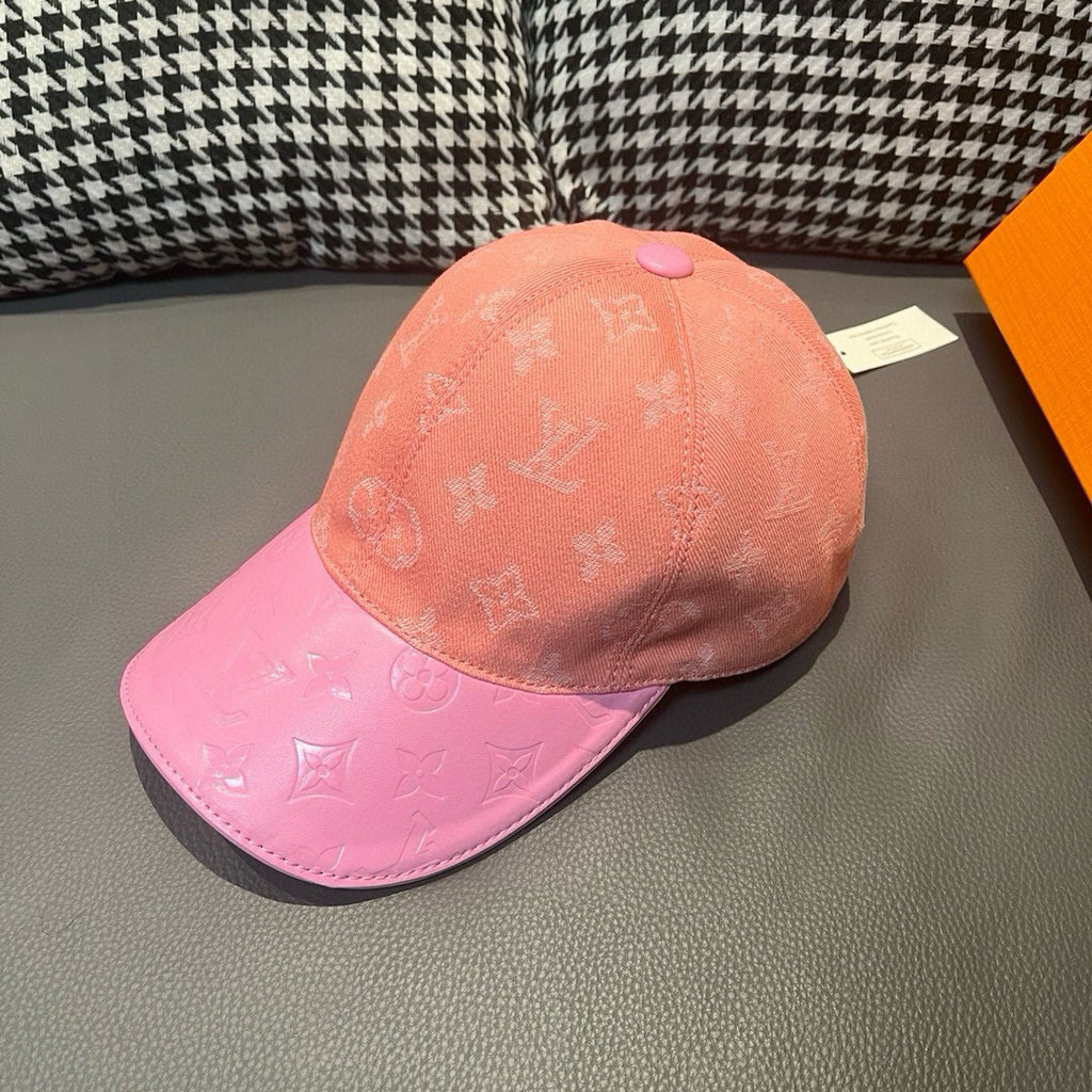 Two-tone Louis Vuitton monogram baseball cap, peach crown and pink brim with curved edge.