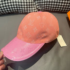 Two-tone Louis Vuitton monogram baseball cap, peach crown and pink brim; side tag.