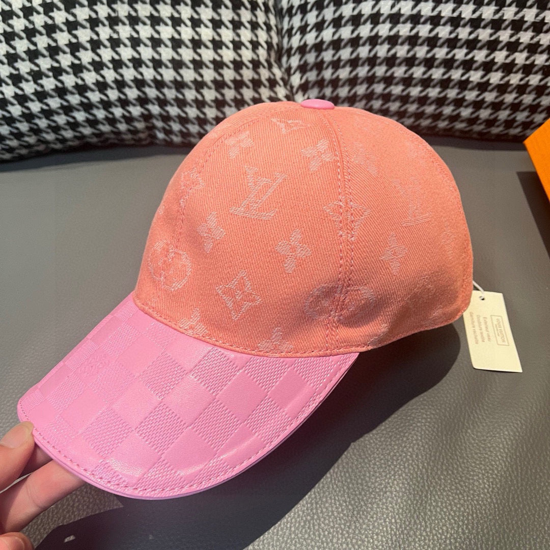 Louis Vuitton two-tone monogram cap with peach crown and pink checkered brim