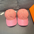 Pair of Louis Vuitton two-tone monogram caps with peach crowns and pink brims