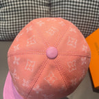 Louis Vuitton two-tone monogram cap top view in peach with round button