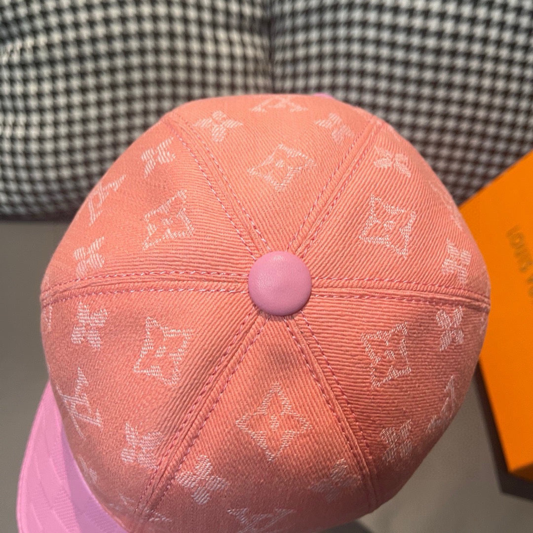 Louis Vuitton two-tone monogram cap top view in peach with round button