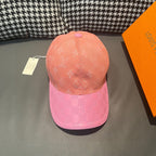 Louis Vuitton two-tone monogram cap with peach crown and pink checker brim