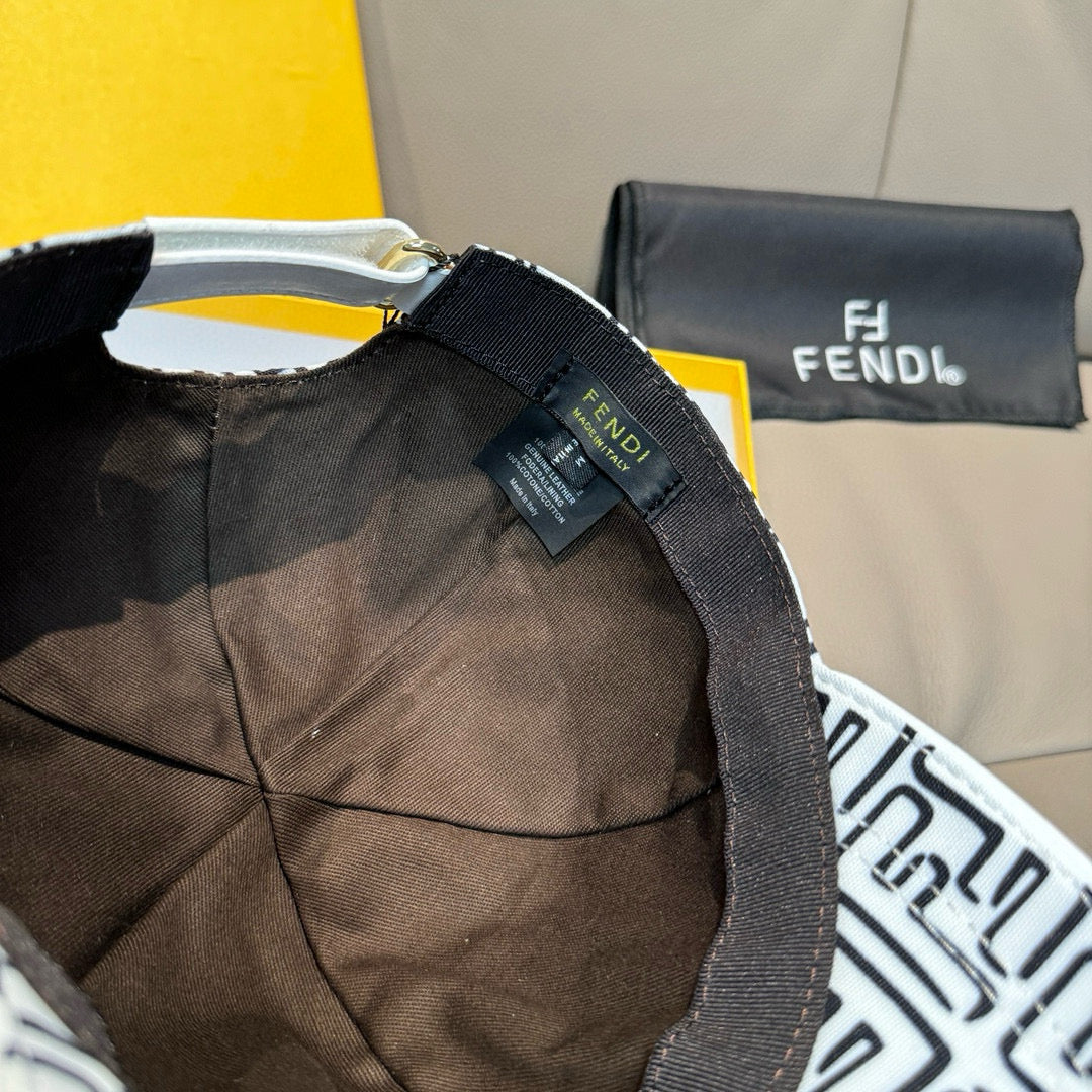 Baseball cap with dark interior and adjustable strap with Fendi tag.