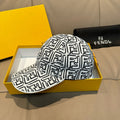 Baseball cap with white-and-black logo pattern and curved brim.