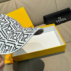 Baseball cap brim edge in logo pattern, showing stitched seam.