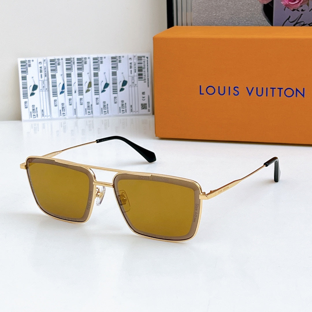 Louis Vuitton sunglasses with gold frame and amber tinted lenses, black temple tips.
