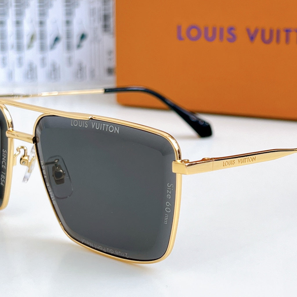 Louis Vuitton sunglasses close-up: gold frame with dark lenses and black temple detail.