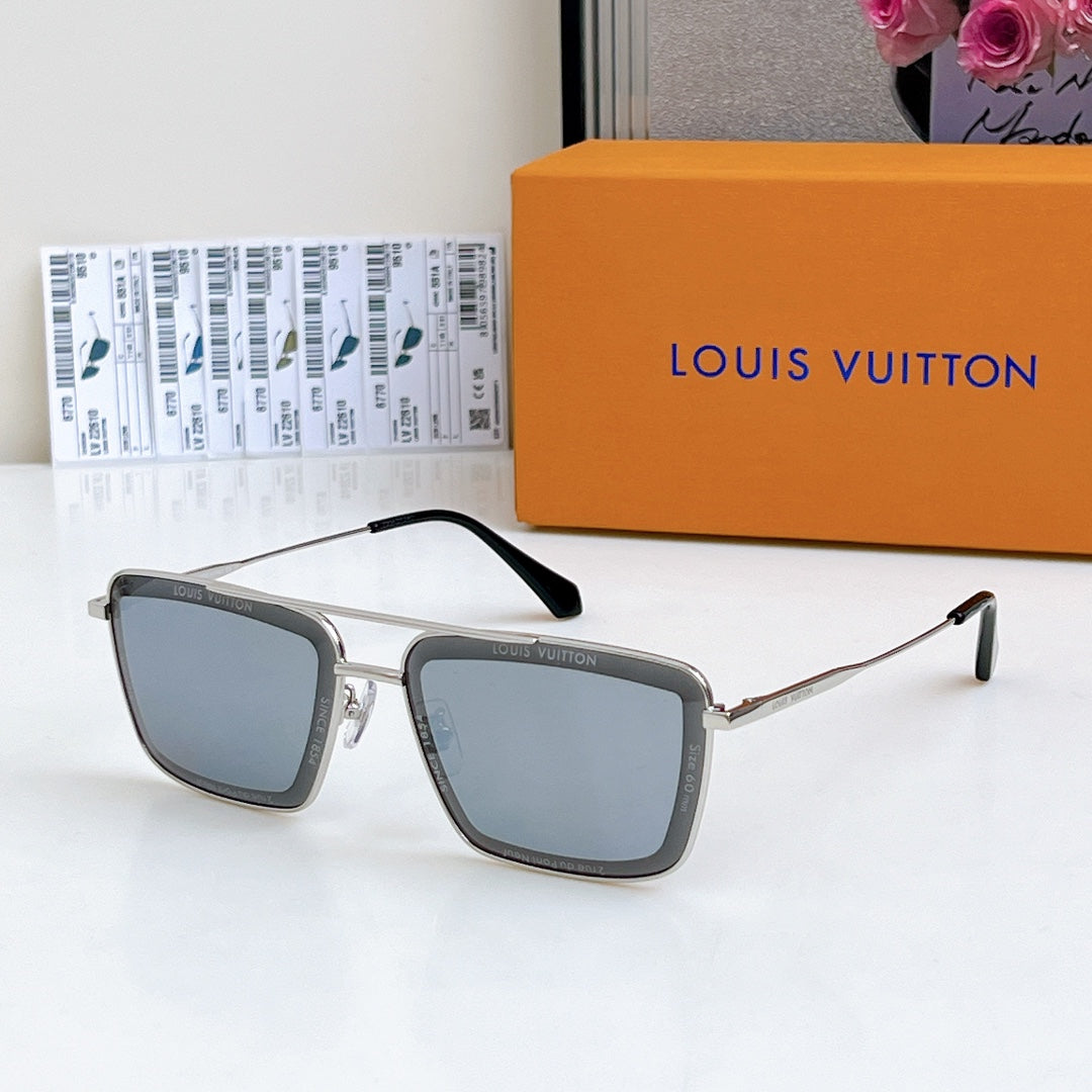 Louis Vuitton sunglasses with silver frame and blue-gray tinted lenses, black temple tips.