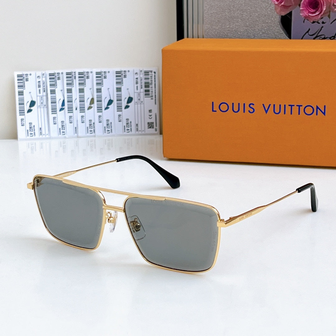 Louis Vuitton sunglasses with gold frame and gray-blue tinted lenses, black temple tips.