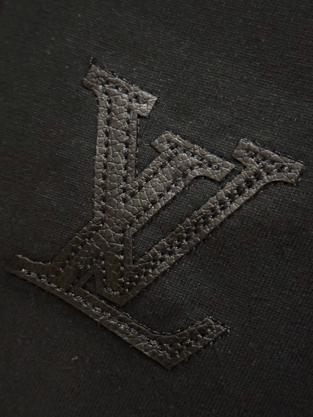 Black T-shirt with textured embroidered V logo