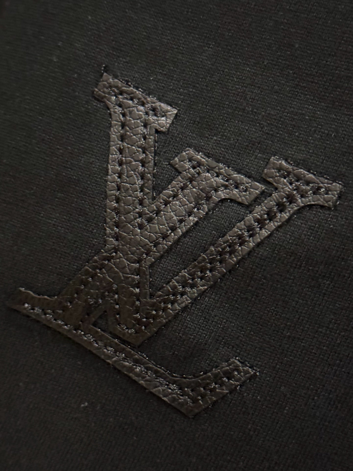Black T-shirt with textured embroidered V logo