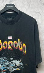 Dark gray crew-neck T-shirt with partial front graphic lettering and small flag patch