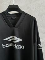 Balenciaga long-sleeve V-neck shirt on hanger with front and partial sleeve logo