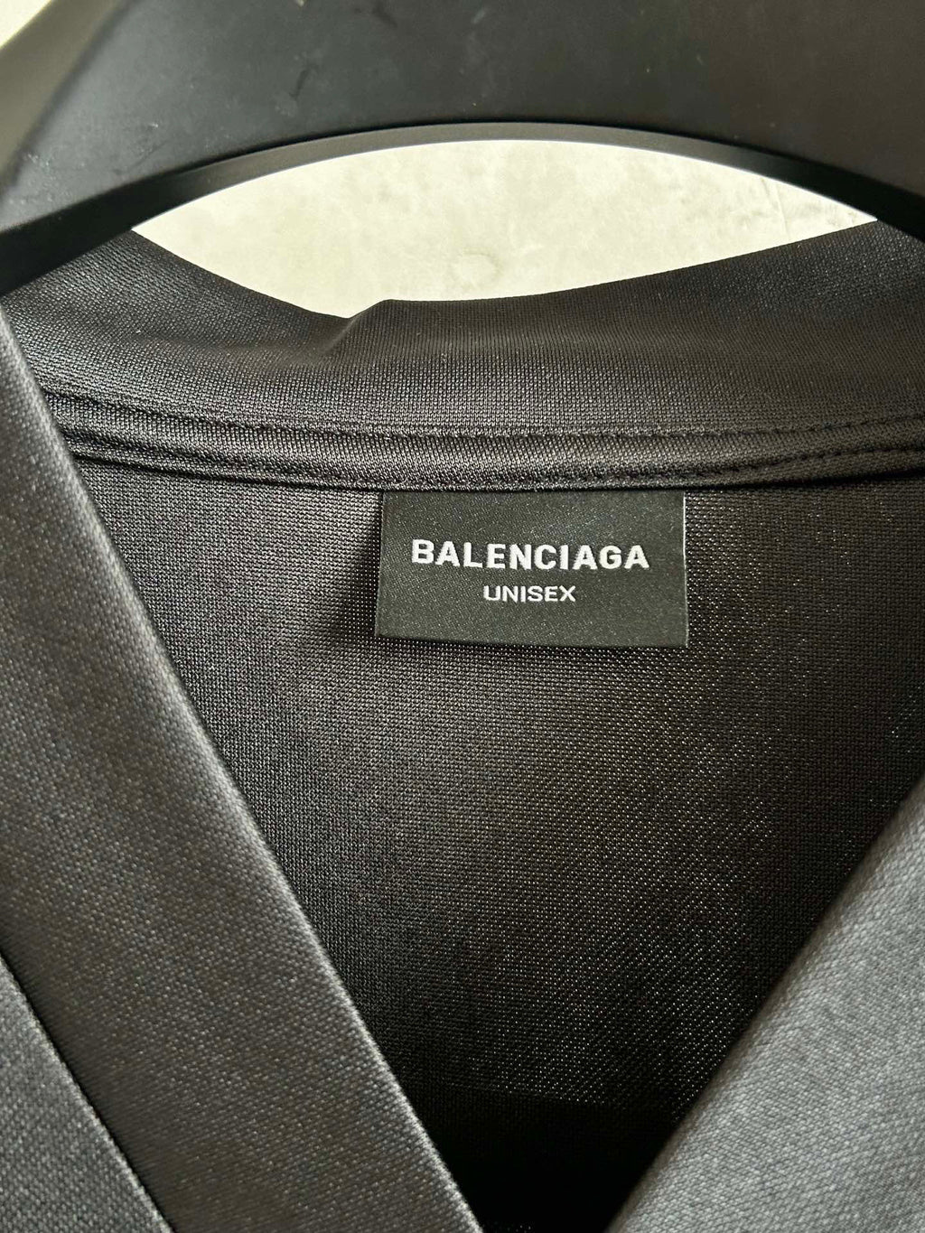 Balenciaga unisex size tag at inner neck of long-sleeve shirt, black fabric