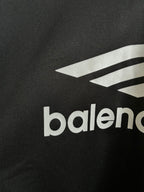 Balenciaga long-sleeve shirt close-up of white logo graphic and balenciaga text on black