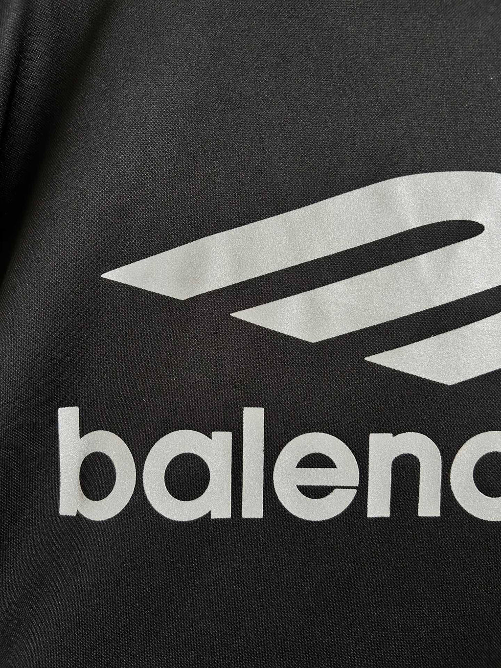 Balenciaga long-sleeve shirt close-up of white logo graphic and balenciaga text
