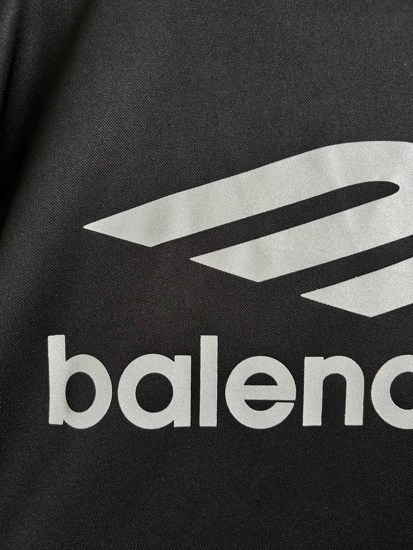 Balenciaga long-sleeve shirt close-up of white logo graphic and balenciaga text