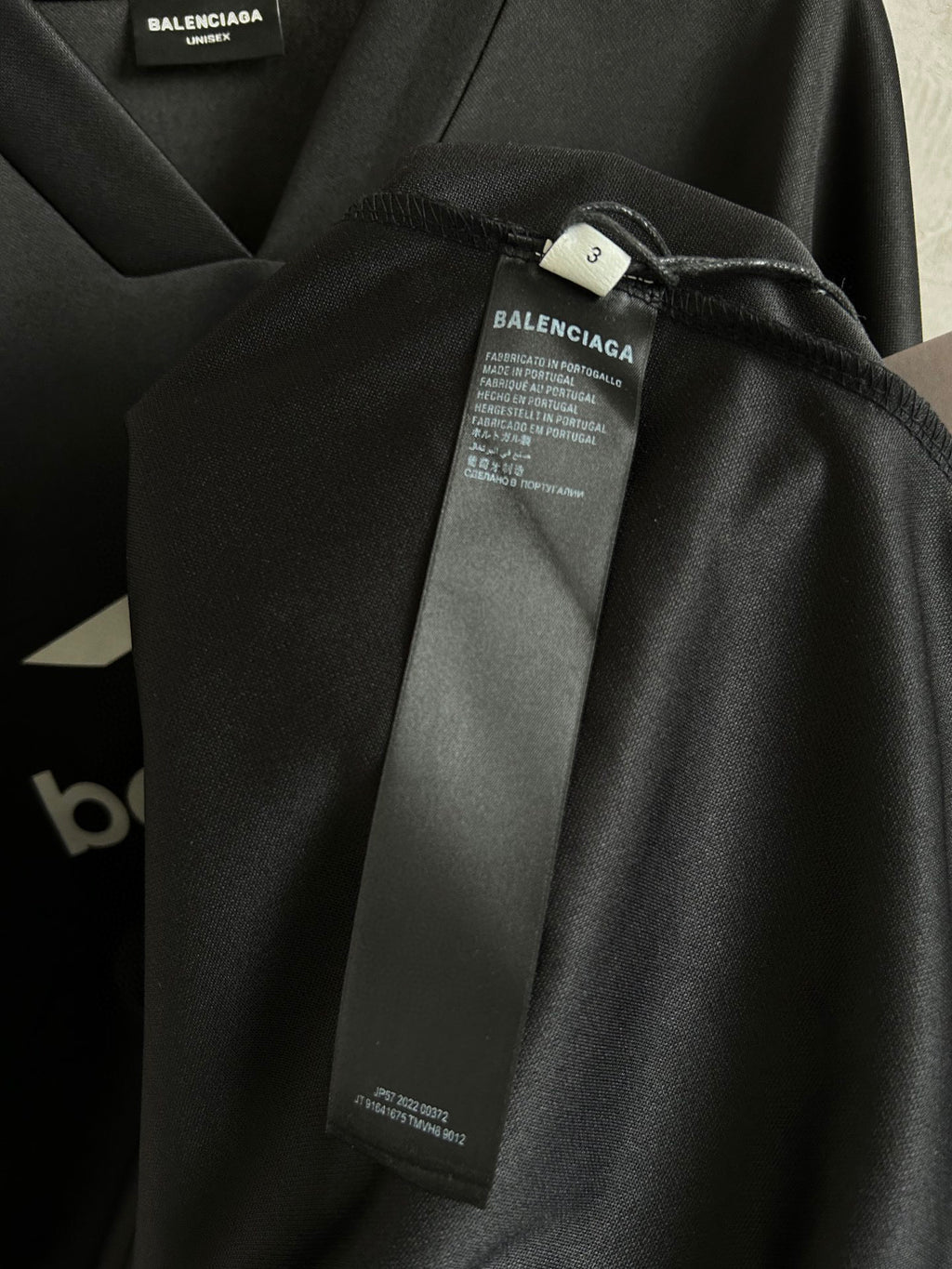 Balenciaga long-sleeve shirt sleeve detail with printed cuff and inner label