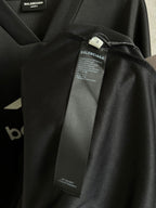 Balenciaga long-sleeve shirt sleeve detail with printed cuff and inner label