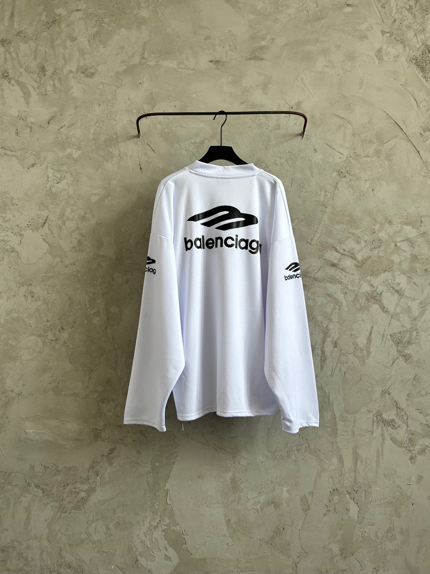 Balenciaga long-sleeve top in white with center logo and side sleeve prints