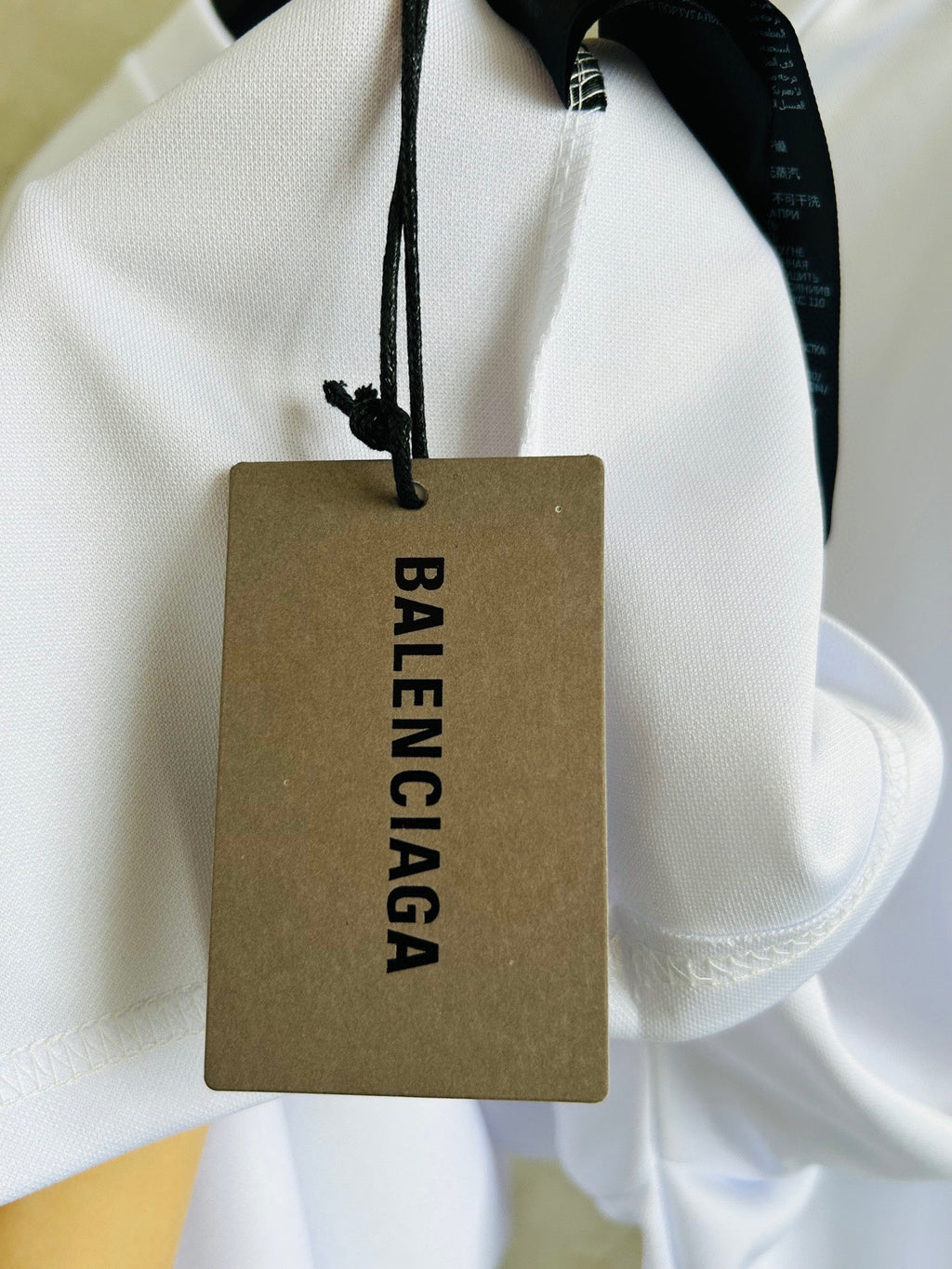 Balenciaga white long hoodie with drawstring and hanging logo tag