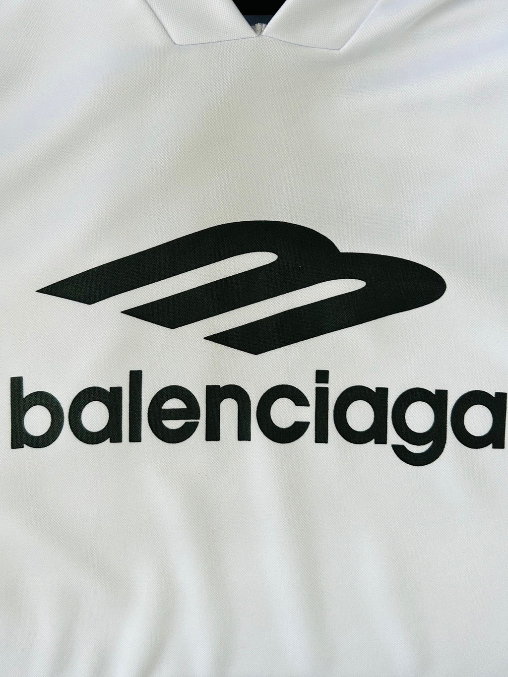 Balenciaga logo on white long-sleeve V-neck top