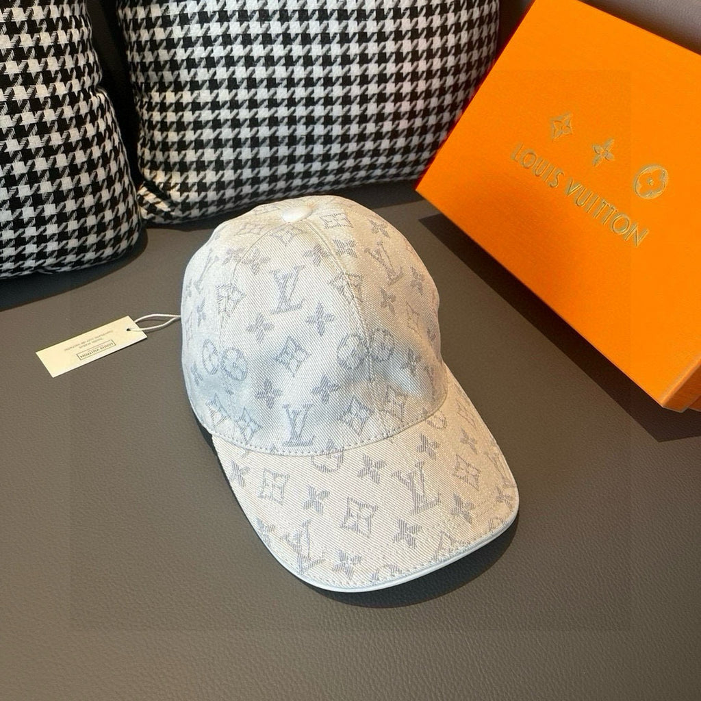 Light beige monogram canvas cap with blue allover print and curved brim