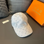 Light beige monogram canvas cap with blue allover print and curved brim