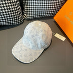 Light beige monogram canvas cap with blue pattern, curved brim and top button