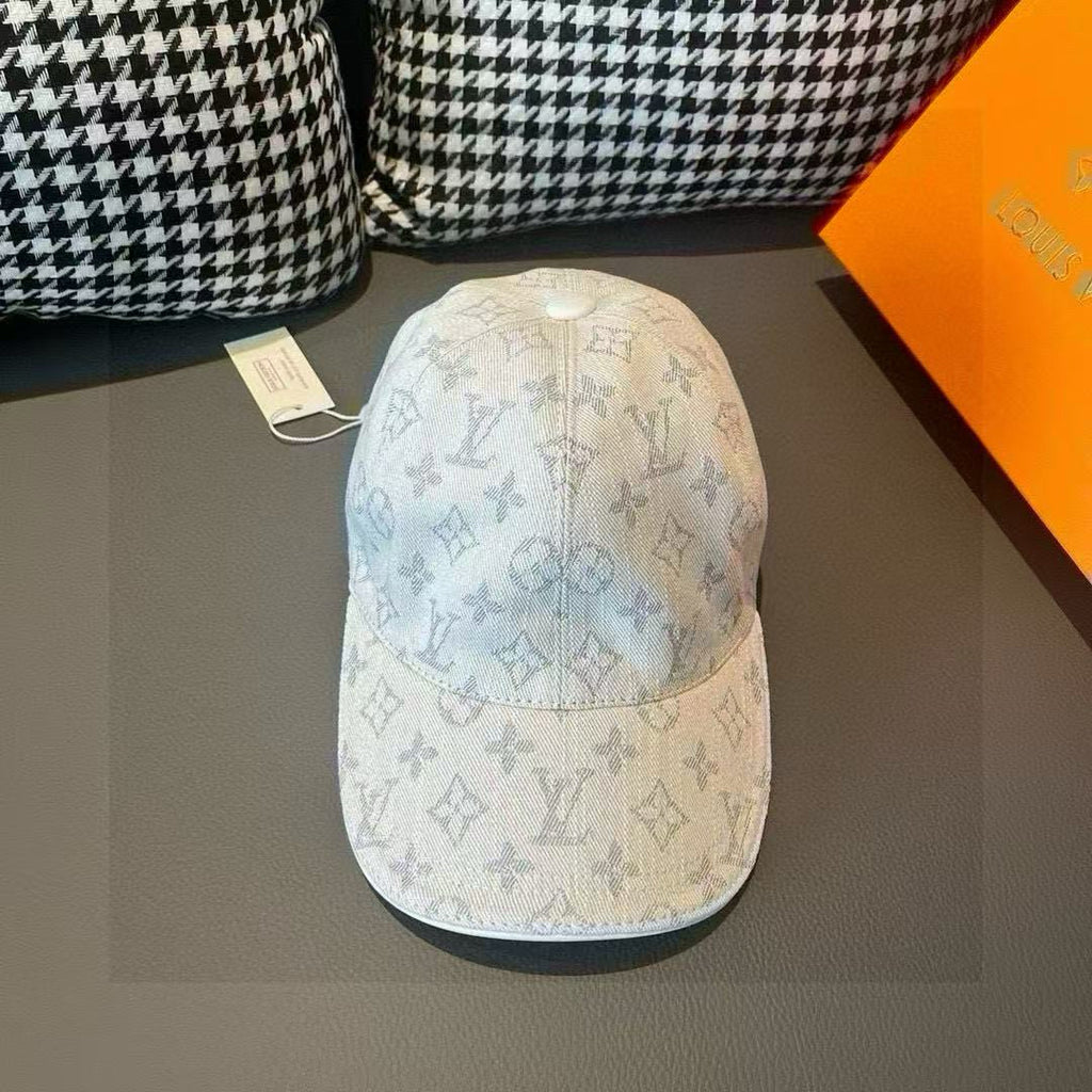 Light beige monogram canvas cap with blue logo print and curved brim