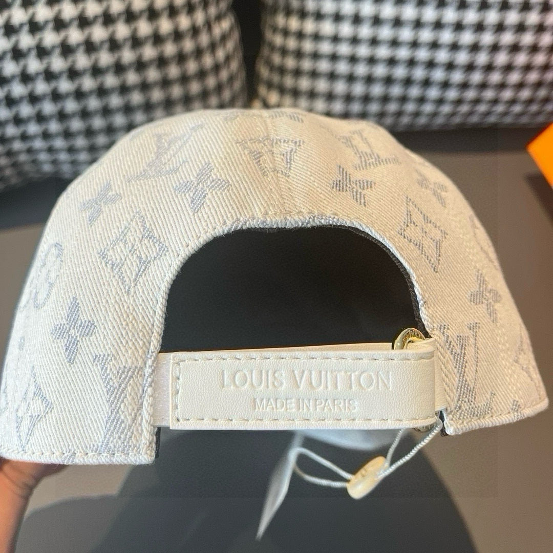 Light beige monogram canvas cap with Louis Vuitton label on adjustable strap