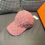Pink monogram baseball cap, side view with curved brim and decorative seams