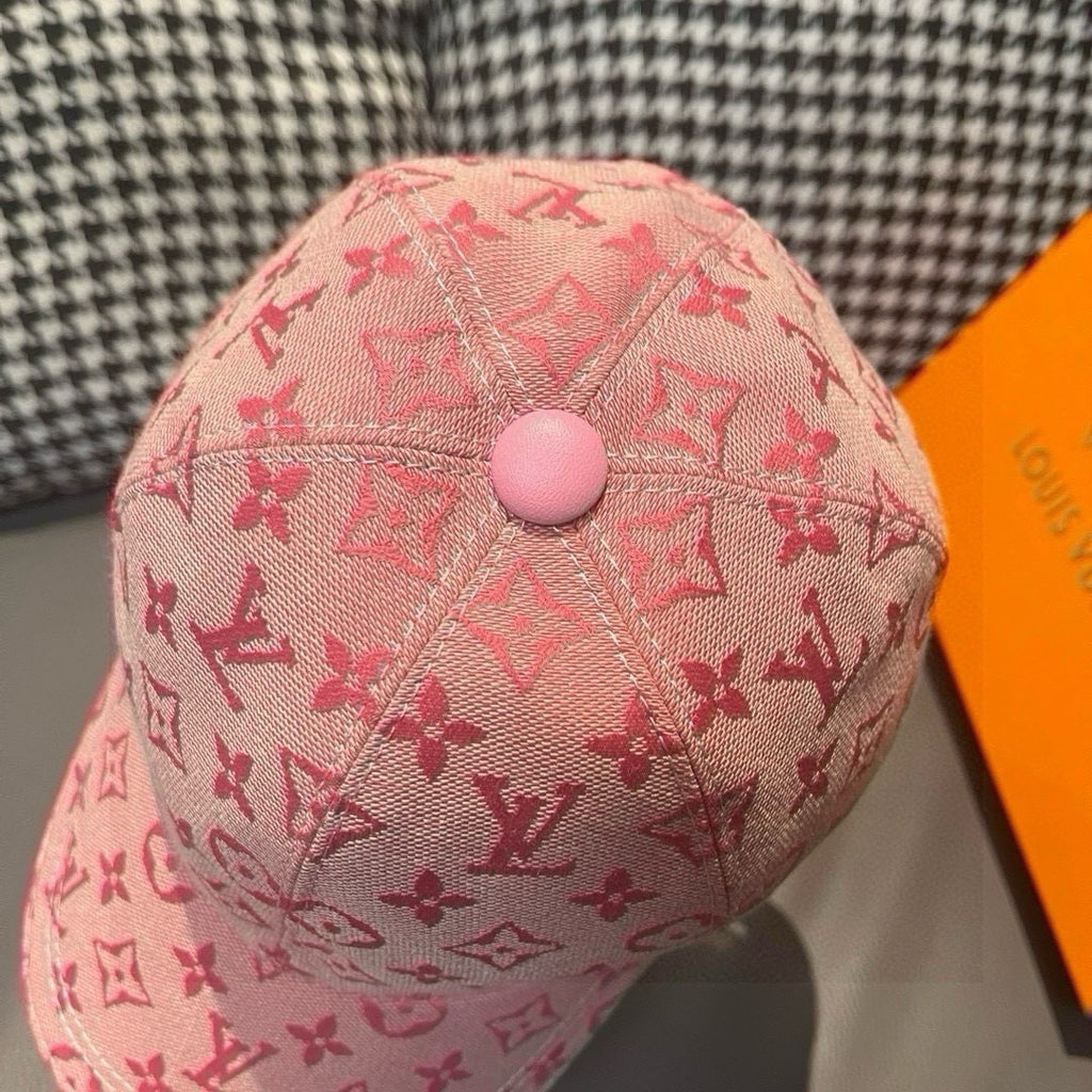 Pink monogram baseball cap with round top button and curved brim