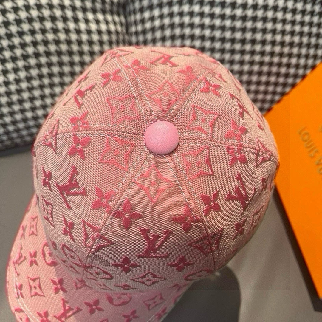 Pink monogram baseball cap with round top button and curved brim
